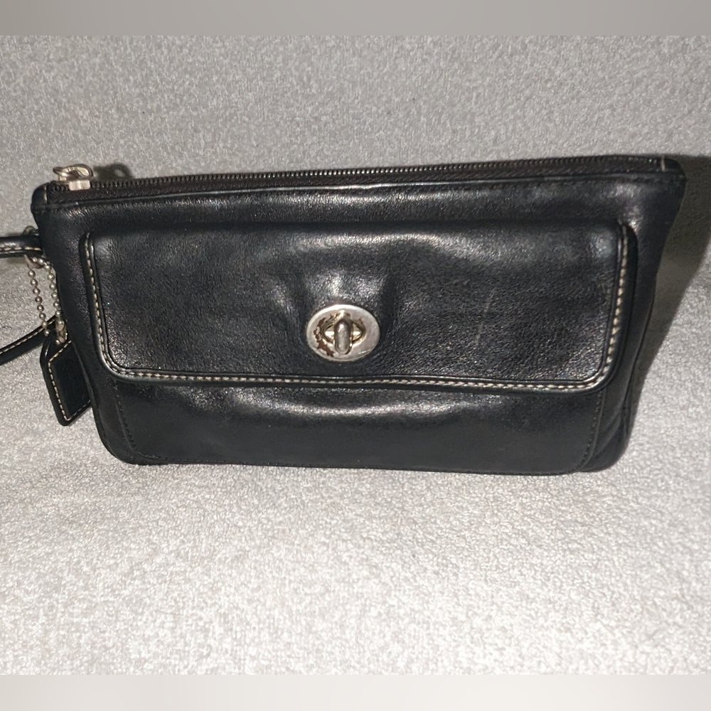 Coach black leather turn lock flap wristlet.